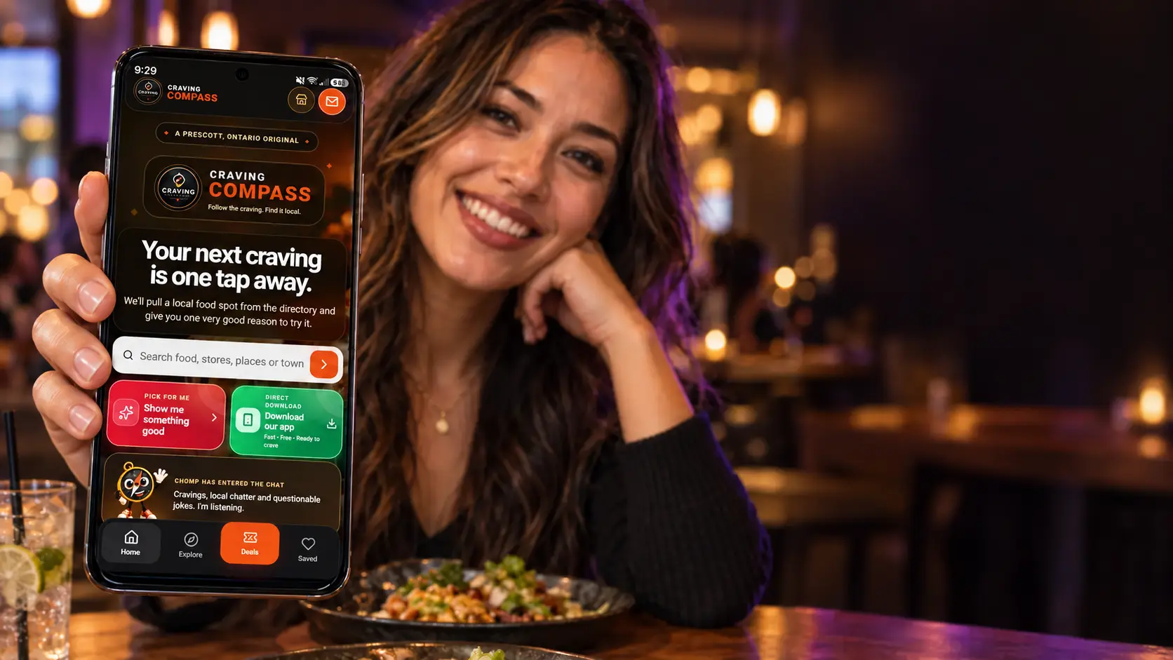Craving Compass app displayed on an Android phone in a restaurant